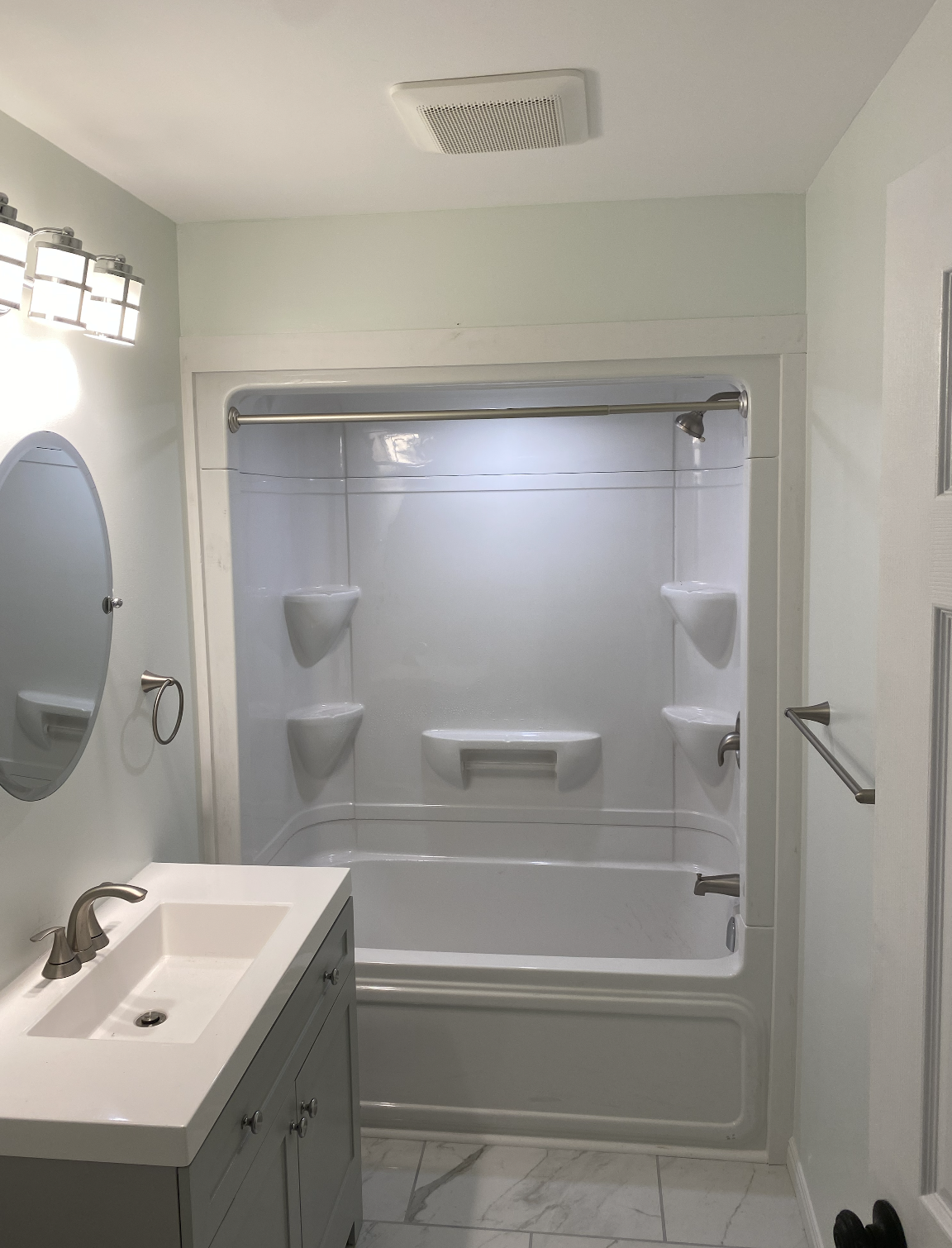 Accessible bathroom renovation in North Bay with walk-in shower and safety features for aging in place